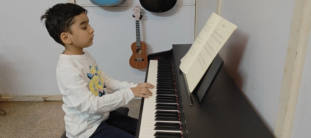 Piano teacher with student